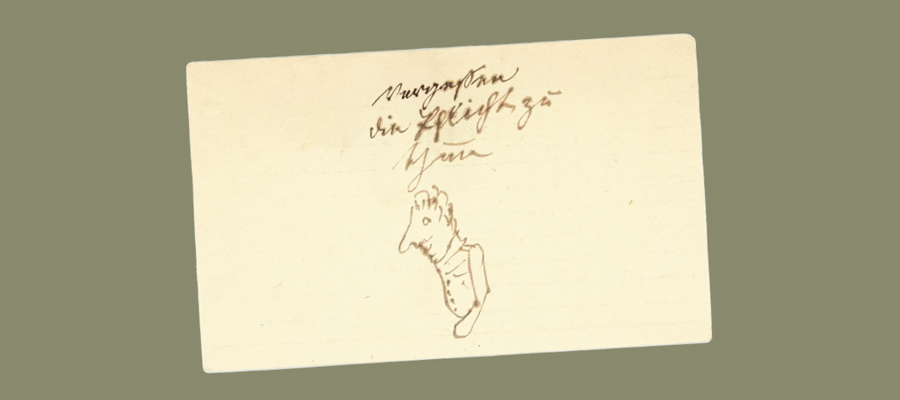 A small piece of paper with a pencil sketch of a side profile of a human head and shoulders, with illegible handwriting at the top and the number R22905 on the right.