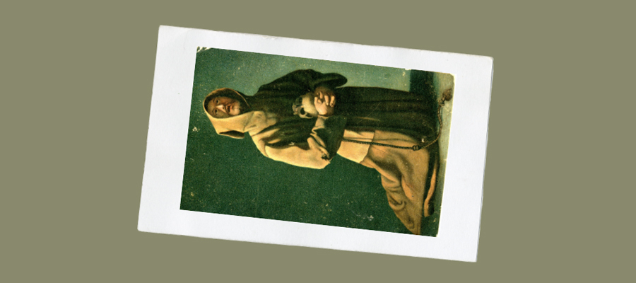 An old photograph of a Catholic monk in a brown robe, holding a rosary.