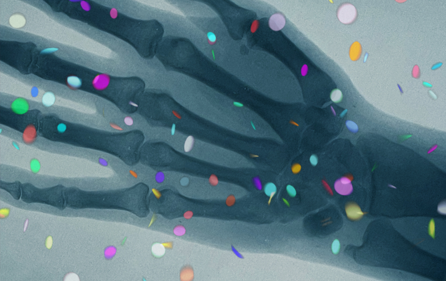 Hand x-ray visualization with festive colorful confetti.